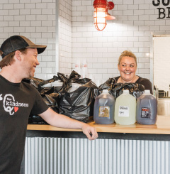 Sonny's employees share a laugh while preparing to-go order