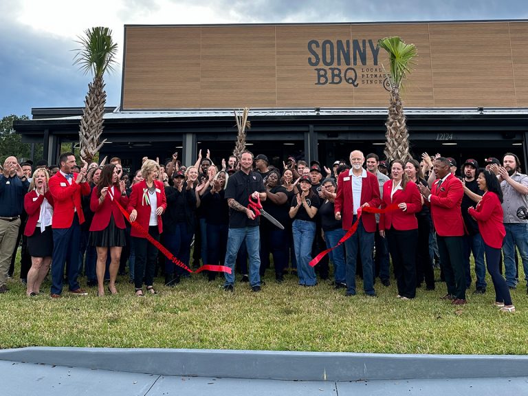 Local Pitmaster Greg Schilling cuts the ribbon on Sonny's Lake Buena Vista