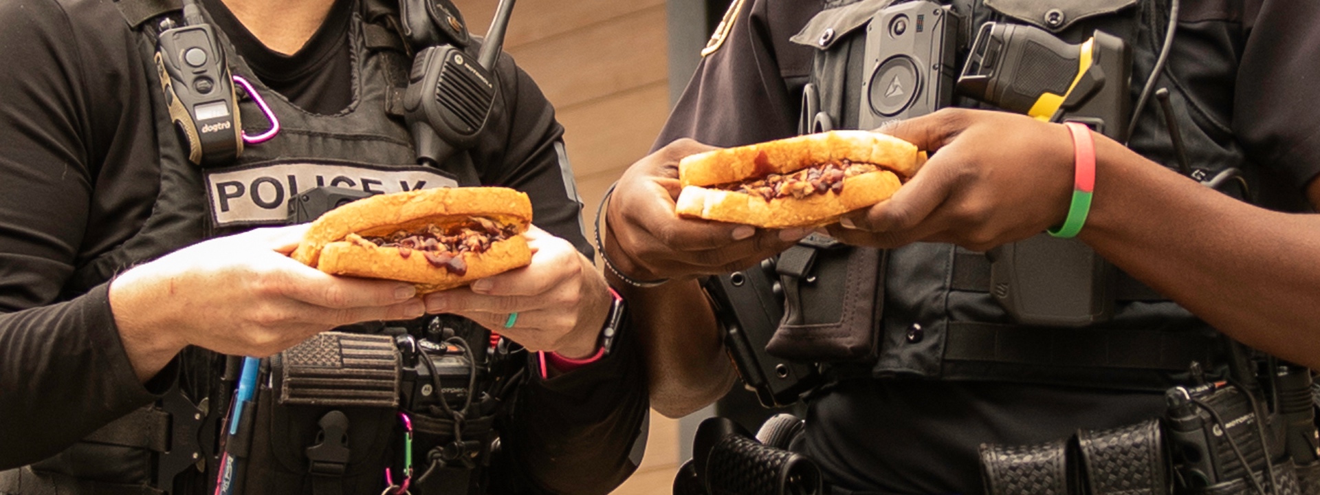 First Responders holding Sonny's BBQ Sandwiches